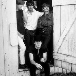 The Beatles (John Lennon, George Harrison, Paul McCartney, & Ringo Starr hanging out by a barn door.) in Ozarks, Arkansas, c. 1965