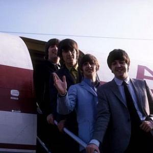 The Beatles, (John Lennon, George Harrison, Ringo Starr, Paul McCartney) getting off the plane.