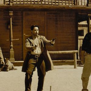 From Left to Right: Marc Cass, Emilio Estevez and director Gene Quintano talking through scenes in 'Dollar for the Dead' in Almeria, Spain.