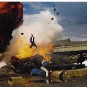 Marc Cass performing an Air Ram Stunt over an Exploding Car for a newspaper story