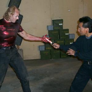 Therion (Trygve Lode) and Dragon (Julian Lee) fight in the warehouse in Dragon and the Hawk.