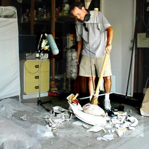 Yann Delpuech breaking a toilet with a sledge hammer for Dreamcatcher