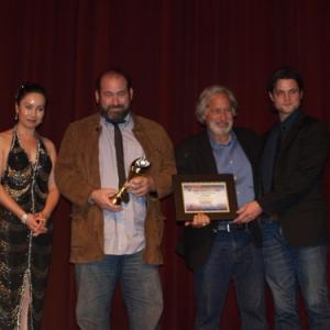 Daniel Adams accepting the Golden Angel Award for The Lightkeepers with Harris Tulchin and Jason Alan Smith