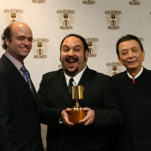 Scott Adsit l and James Hong r present the TV character design award to Jorge Gutierrez