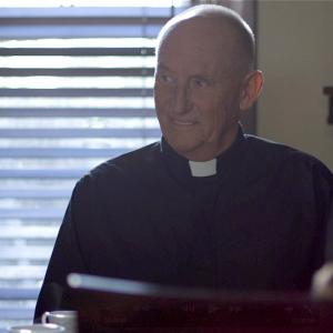 Jeremy Akerman as Father Gene in 