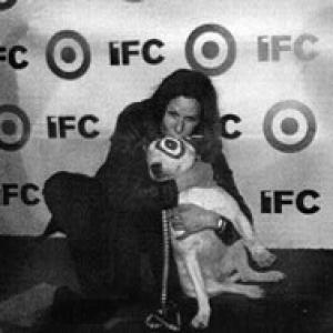 Mary Aloe on the red carpet with the IFC mascot after the Independent Spirit Awards
