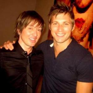 Click On This host Johnny Alonso with actor Justin Deeley from the New 90210 at Tyler Shields Mouthful event at Ace Studios in Los Angeles Ca