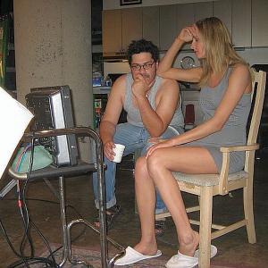 Actress Amy Rasimas and Carlos Antonio watch themselves on the playback while shooting ID Intelligent Design