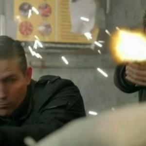 Still of Michael Aronov as Person of Interest Mike Cahill apposite undercover partner Jim Caviezel