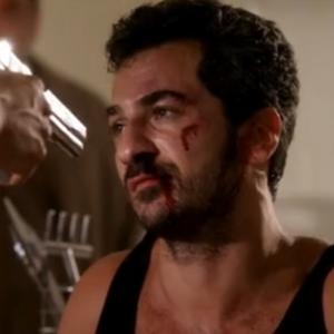 Still of Michael Aronov as resilient heavy and hitman in BURN NOTICE