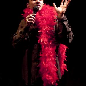 Still of Michael Aronov as the saucy and resilient Chacha in his solo show MANIGMA