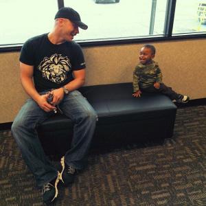 Chris makes a kid laugh while waiting for his friend, actress Tricia Jo Hoffman, at a store in New Orleans, LA.