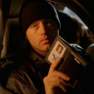 Sergei Malatov (Chris Ashworth) presents his fake credentials to get past security in order to kidnap the engineer, in Season 2.