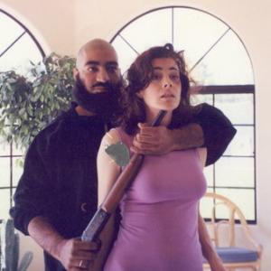 Sean Young and Sayed Badreya in Mirage (1995)