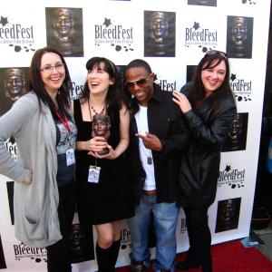 Cindy Baer wins the Audience Award for Morbid Curiosity at Bleedfest 2011 Pictured here with festival codirectors Elisabeth Fies and Brenda Fies and rapper Lil Zane