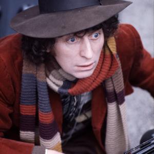 British actor Tom Baker in his best-known role as Dr Who, between two of his arch enemies, the Daleks at BBC TV Centre, London, 1974.