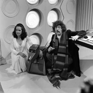 British actor Tom Baker who plays the Doctor in the BBC Television Series Dr Who. Pictured here with his assistant Romana played by Mary Tamm and the robot dog K9.