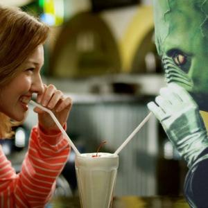 alien and girl drinking a milkshake