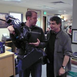 Paul Lieberstein explains the function of the camera to an editor.