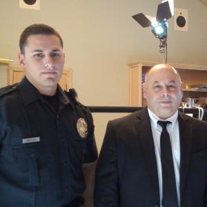 Dave Bean and real-life police officer prep for a scene on an upcoming tv show.