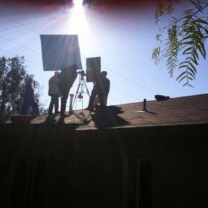 Ashley Hinson (as Janice) and Dave Bean (as Det. Les Strade) prepare for a rooftop shot in thriller 
