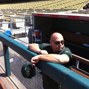 Dave Bean on the set at Dodger Stadium as an Oakland As coach in the upcoming film Moneyball which stars Brad Pitt Philip Seymour Hoffman and Jonah Hill