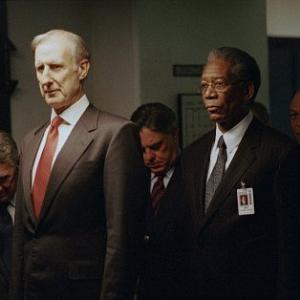 (Foreground, left to right) James Cromwell as President Fowler and Morgan Freeman as DCI William Cabot, (background, left to right) Philip Baker Hall as Defense Secretary Becker, Bruce McGill as National Security Advisor Revell and John Beasley as General Lasseter in 