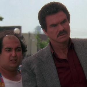 Cop & ½. Pictured left to right - Mike Benitez and Burt Reynolds.