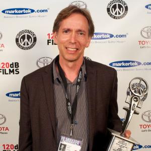 Poustinia director Kristian Berg at the 2013 Woodstock Film Festival with the Diane Seligman Award for best short documentary