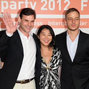 Actors Alexander Beyer and Tom Wlaschiha pose together with producer Yoko Higuchi Zitzmann during a photo call at the Filmparty NRW hosted by Film- und Medienstiftung NRW on June 19, 2012 in Cologne, Germany.