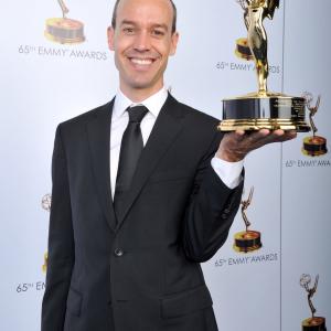Andy Bialk poses with the award for Outstanding Individual Achievements in Animation for Dragons: Riders of Berk onstage at the 2013 Primetime Creative Arts Emmy Awards, on Sunday, September 15, 2013 at Nokia Theatre L.A. Live, in Los Angeles, Calif.