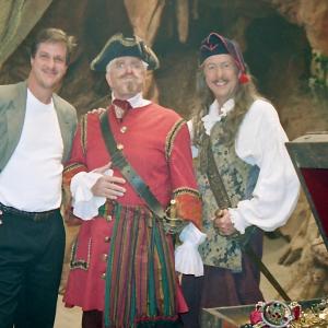 Jon Binkowski (Sr. Producer) with Leslie Nielsen and Eric Idle on the set of 