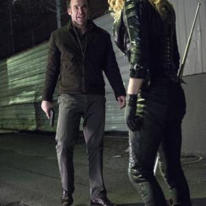 Still of Paul Blackthorne and Caity Lotz in Strele 2012