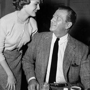John Wayne and Pat Blake in the Green Room at Warner Bros. Studios, 1955.