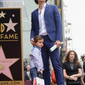 Actor Orlando Bloom and his son Flynn Bloom attend the Hollywood Walk of Fame celebration in honor of Orlando Bloom on April 2, 2014 in Hollywood, California.