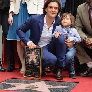 Actor Orlando Bloom and his son Flynn Bloom attend the Hollywood Walk of Fame celebration in honor of Orlando Bloom on April 2 2014 in Hollywood California