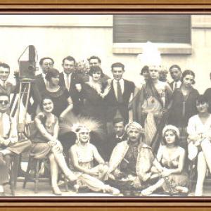 The team who created the silent movie Lache in harem Romania 1927 directed by Marcel Blossoms in the picture sitting at the left side with the umbrella