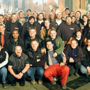 Waterfall City at night on the set of Dinotopia The Series Budapest Hungary April 2002 Pictured with main unit crew Balazs Revesz Frazer Churchill David Winning Martin Kenzie Nyika Jancs Mac Ruth Tamas Mink