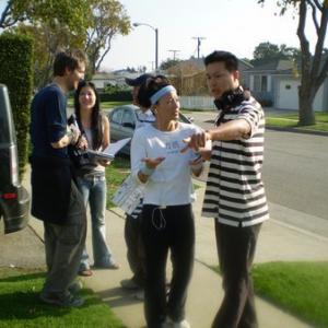 Tom Huang and Tamlyn Tomita setting up for the next shot on the set of Why Am I Doing This?