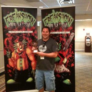 Gabriel Bologna holding the Audience Award for his film The Black Waters of Echos Pond at The Freakshow Horror Film Festival in Orlando Florida