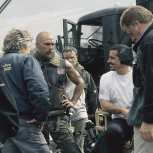 Matthew McConaughey second from left chats with the crew during a break in filming Directed by Rob Bowman