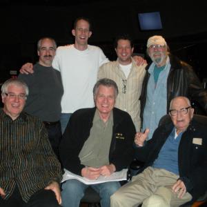 With the orchestration team for DisneyPixars Up at Warner Bros Scoring Stage 2009 Standing LR Peter Boyer director Pete Docter composer Michael Giacchino scoring mixer Dan Wallin seated LR orchestratorconductor Tim Simonec orchestrators Larry Kenton and Jack Hayes