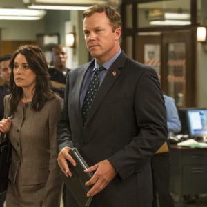 Still of Adam Baldwin Paget Brewster and Paula Foster in Law amp Order Special Victims Unit 1999