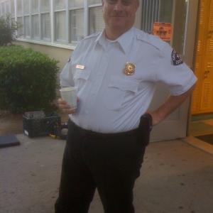 Kevin Brief as security guard on AIM HIGH.