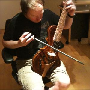 Bill playing the Guitarviol