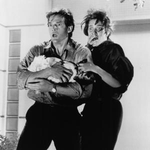 Still of Carey Lowell and Dwier Brown in The Guardian (1990)