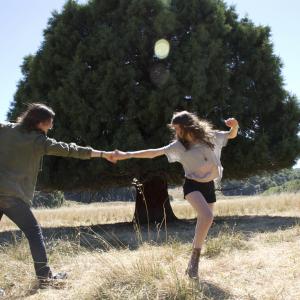 Still of Peter Vack and Natalia Dyer in I Believe in Unicorns 2014