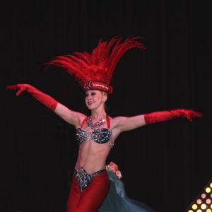 Bayley Brunnmeier in the Folies Bergere acrobat and dancer