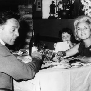 Sybil Burton with Richard and their daughter Kate at a restaurant in Rome
