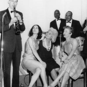 Sybil Burton 2nd from right passed up the New York premiere of Cleopatra 612 starring her husband Richard to go nightclubbing in Chicago She brushed off questions about her husband and costar Elizabeth Taylor Also shown are clarinetist Bill Reinhardt and dancers Georgina Parkinson and Gerd Larsen 06121963